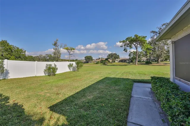 a view of a garden with a building in the background