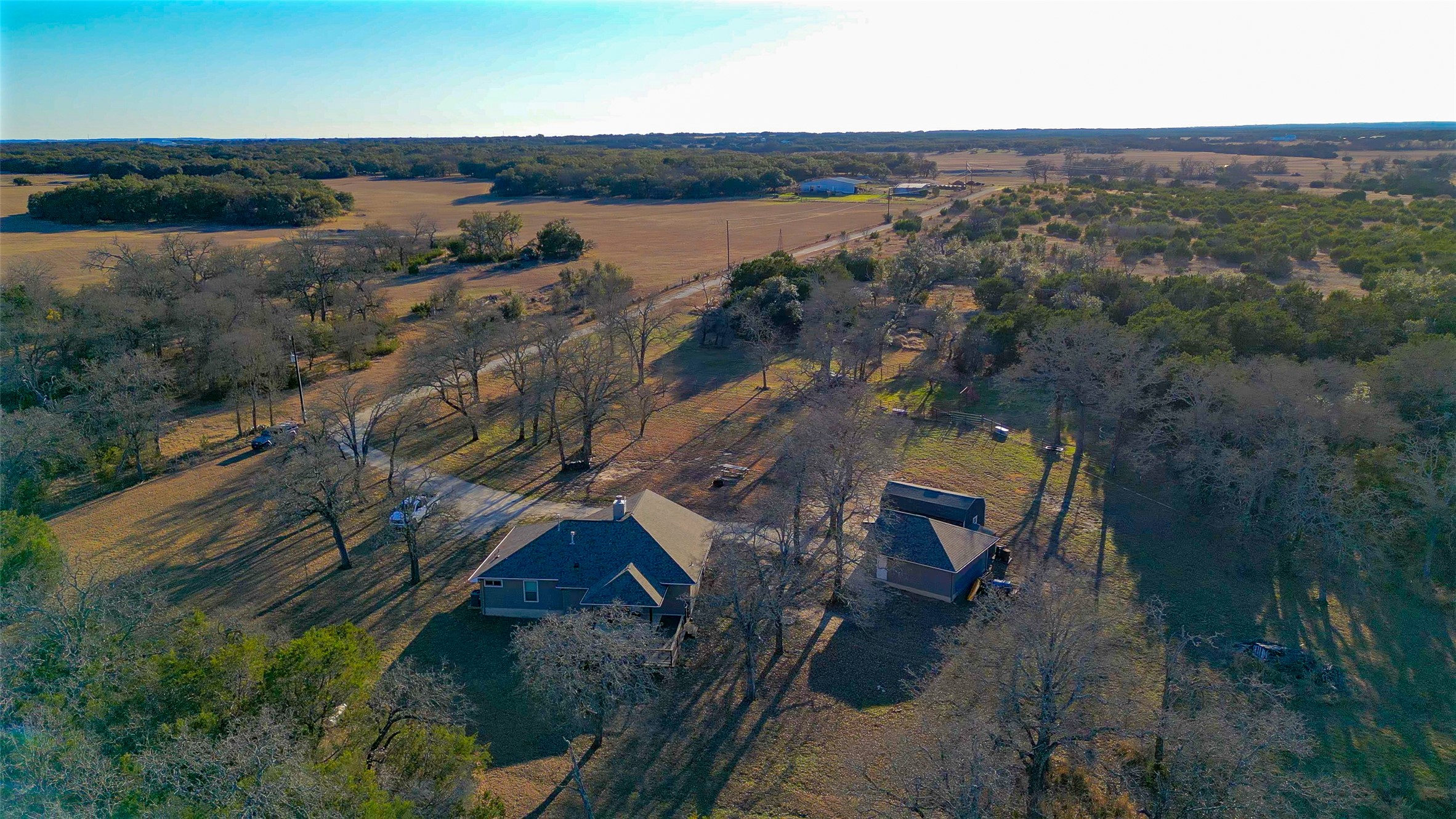 489 Nordic Ridge Road Bertram, TX 78605 - Photo 18 of 19 an aerial view of a house with a yard and lake view