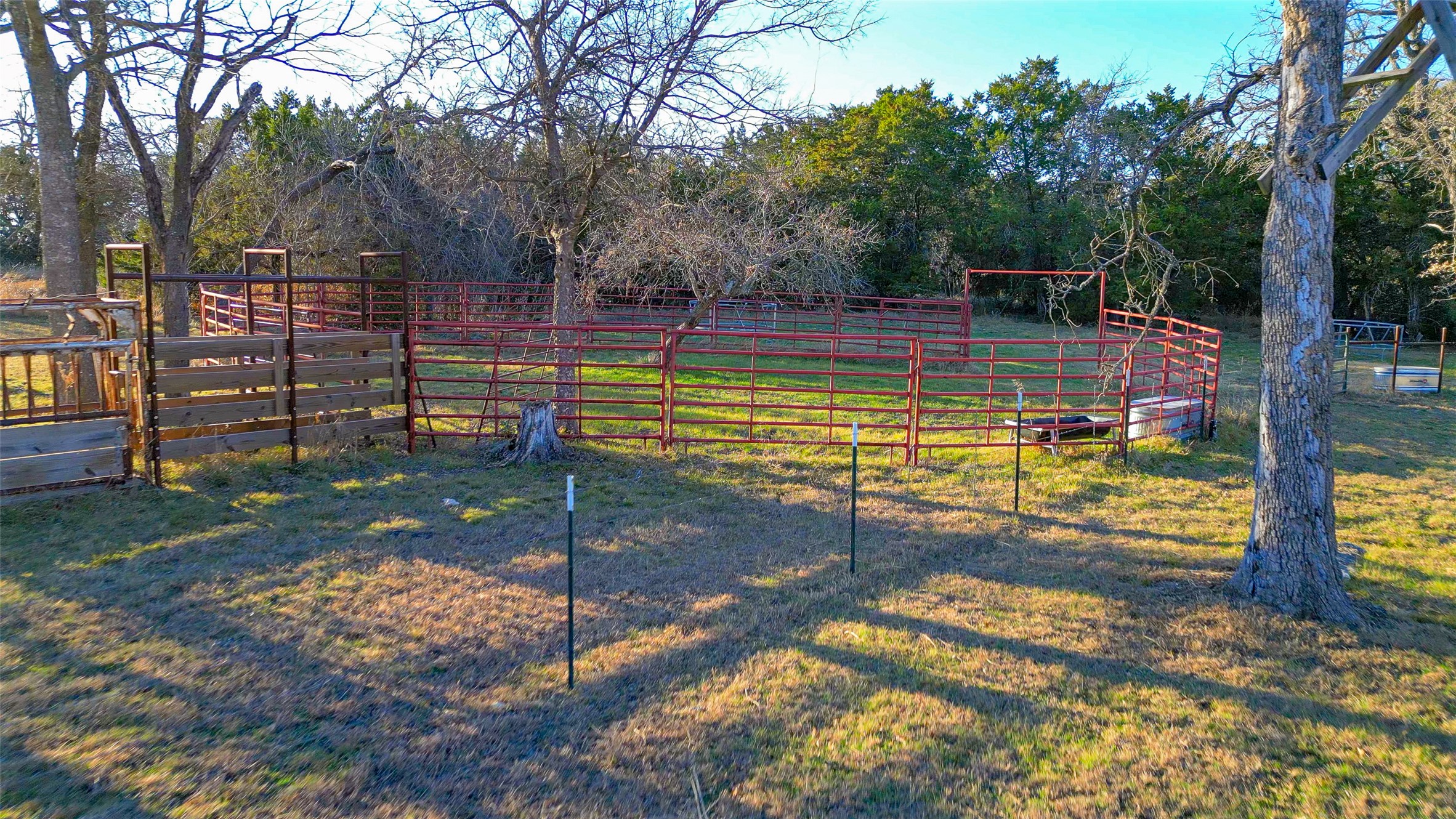 489 Nordic Ridge Road Bertram, TX 78605 - Photo 19 of 19 a view of a tennis ground with large trees