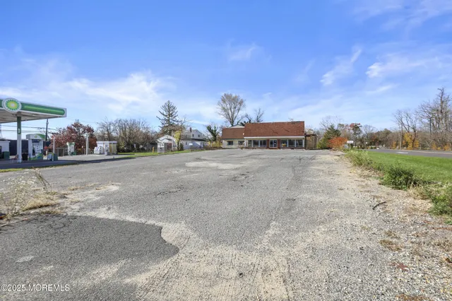 a view of a town with big trees