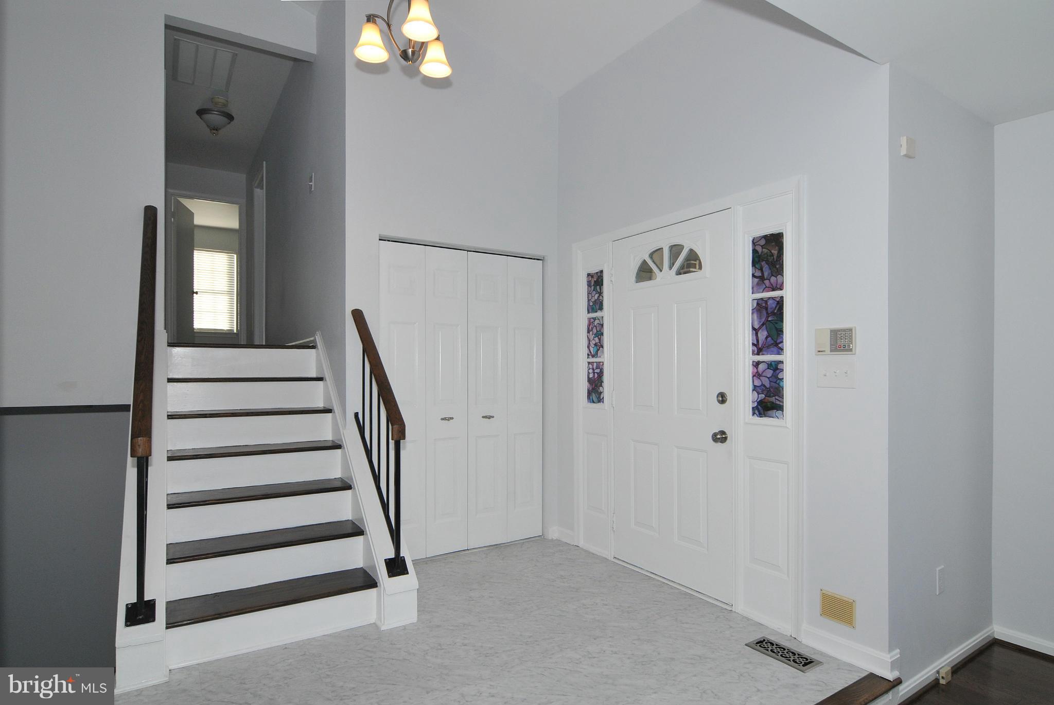 2440 Lyttonsville Road Silver Spring, MD 20910 - Photo 10 of 30 Foyer Steps and Rails Match Hardwood