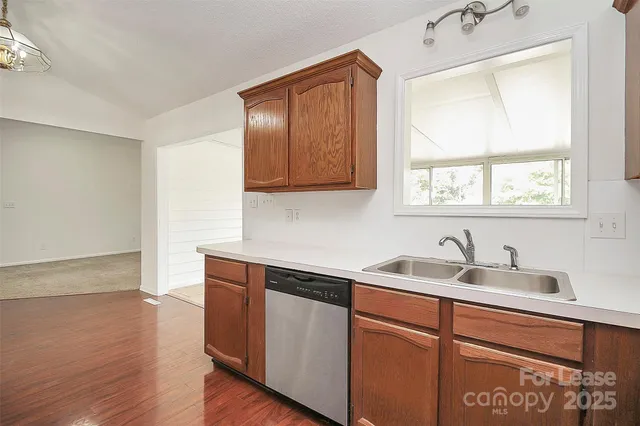 a kitchen with sink cabinets and window