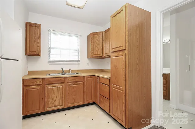 a kitchen with stainless steel appliances a sink and cabinets