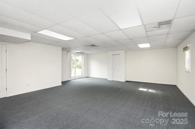a view of empty room with windows