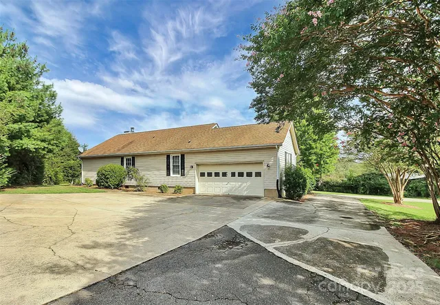 a sign board with yard
