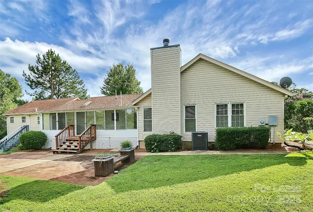 a front view of house with yard and outdoor seating