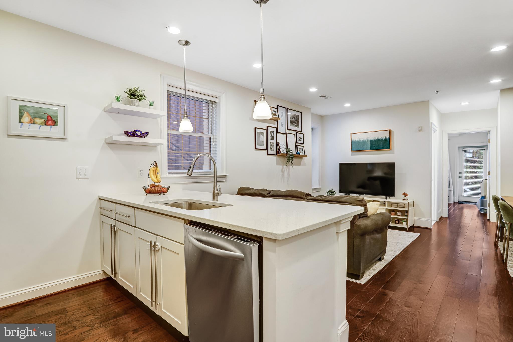 3937 Davis Place Northwest, Unit 1 Washington, DC 20007 - Photo 11 of 20 a view of a kitchen counter space and wooden floor