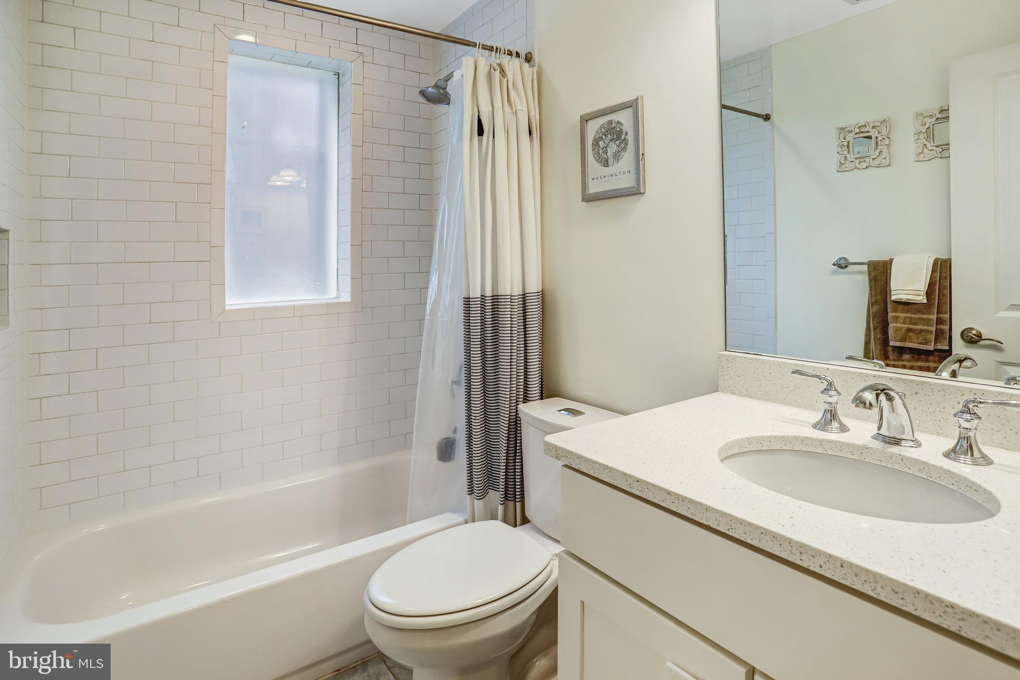 3937 Davis Place Northwest, Unit 1 Washington, DC 20007 - Photo 15 of 20 a bathroom with a sink toilet and shower