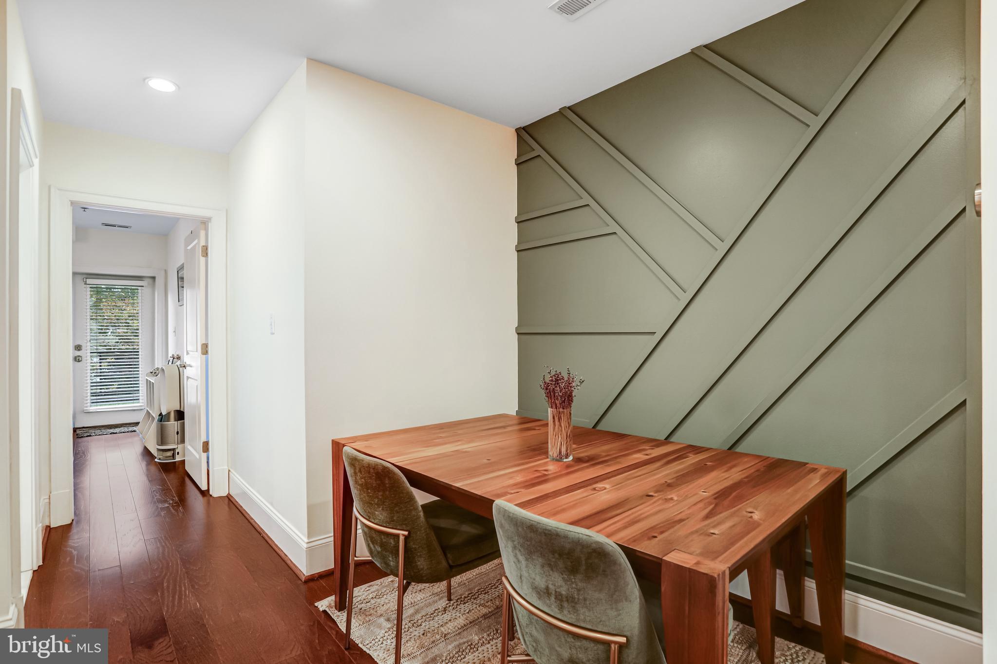 3937 Davis Place Northwest, Unit 1 Washington, DC 20007 - Photo 8 of 20 a dining room with a wooden table and chairs