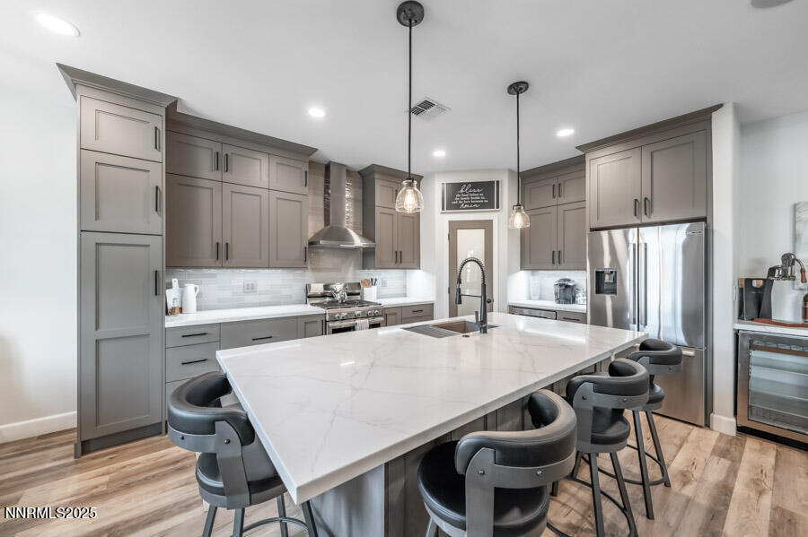 504 Alpine Rose Ct. Reno, NV 89521 - Photo 8 of 27 a kitchen with kitchen island a appliances dining table and chairs