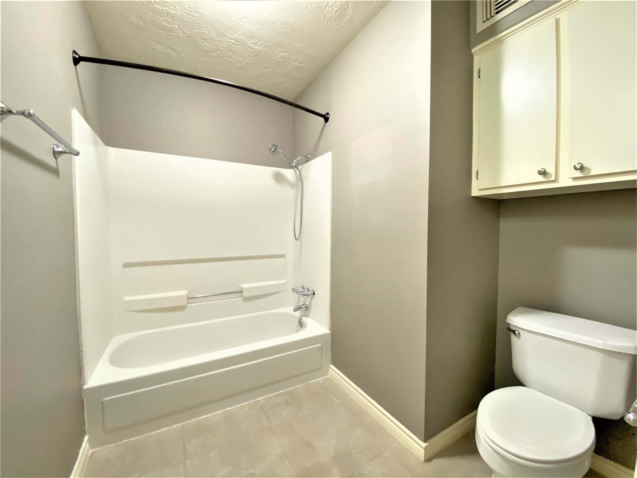 12303 Longfellow Drive Montgomery, TX 77356 - Photo 20 of 26 a bathroom with a toilet and a shower