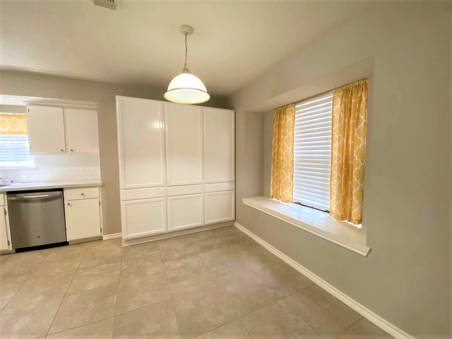 12303 Longfellow Drive Montgomery, TX 77356 - Photo 2 of 26 a view of a kitchen with an empty room and window