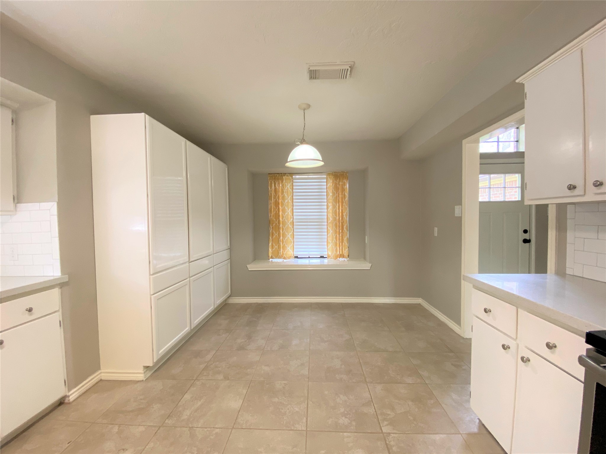12303 Longfellow Drive Montgomery, TX 77356 - Photo 3 of 26 a view of a kitchen with white cabinets