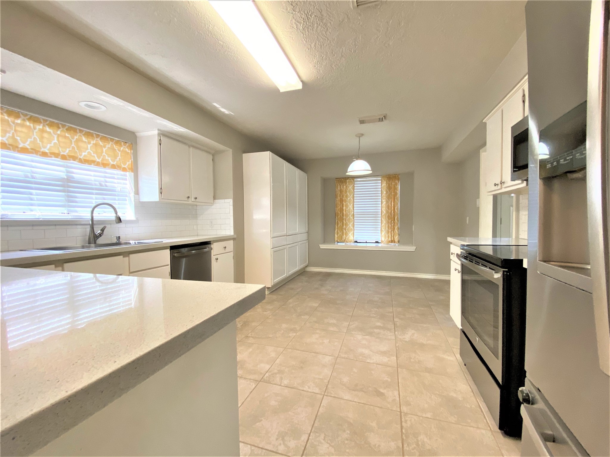 12303 Longfellow Drive Montgomery, TX 77356 - Photo 10 of 26 a view of a kitchen with a sink