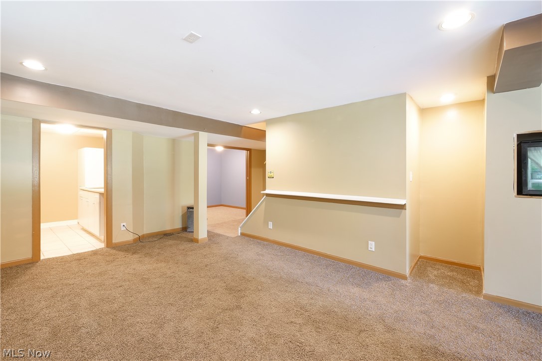 6475 Kungle Road Clinton, OH 44216 - Photo 28 of 35 Finished walkout basement with additional room, laundry room, and half bath