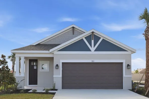a front view of a house with garage