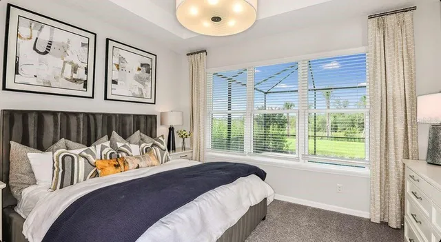 a dining room with furniture a large window and a dining table