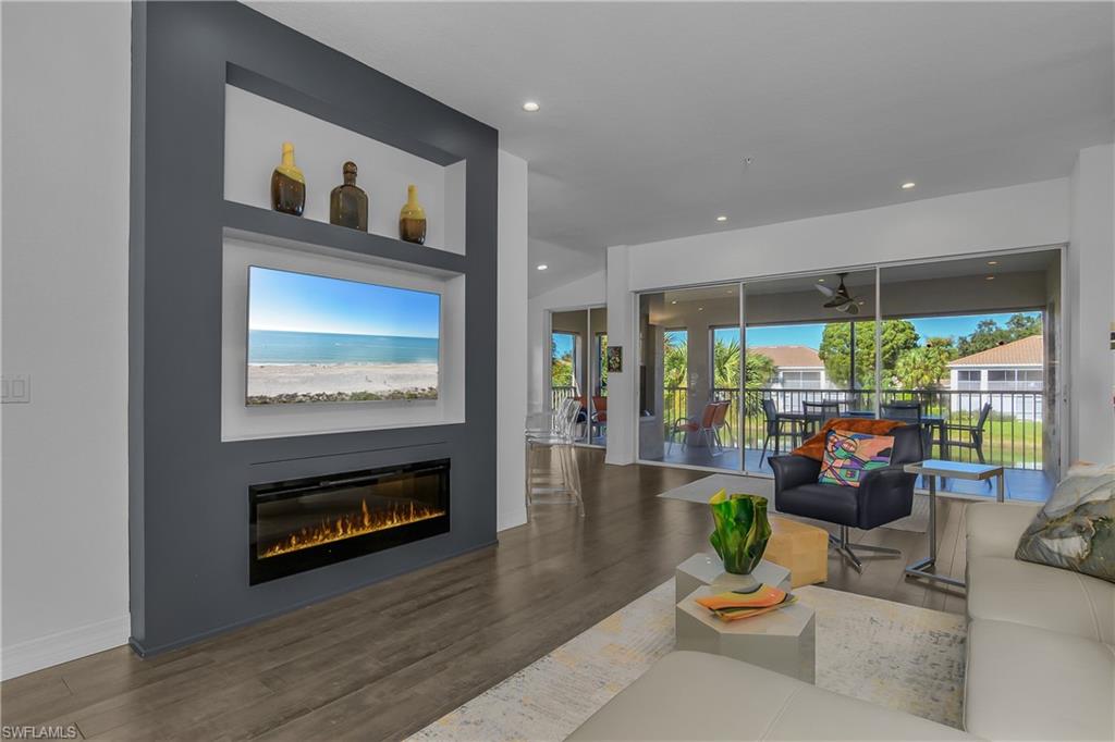 6867 Satinleaf Road South, Unit 201 Naples, FL 34109 - Photo 9 of 50 Custom Entertainment Wall with Linear Fireplace & TV Niche