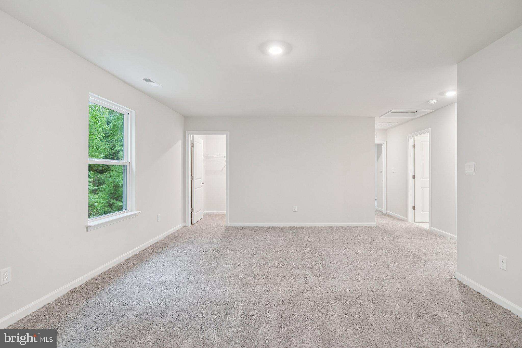 6278 Sterling Way Ruther Glen, VA 22546 - Photo 13 of 32 an empty room with windows and closet