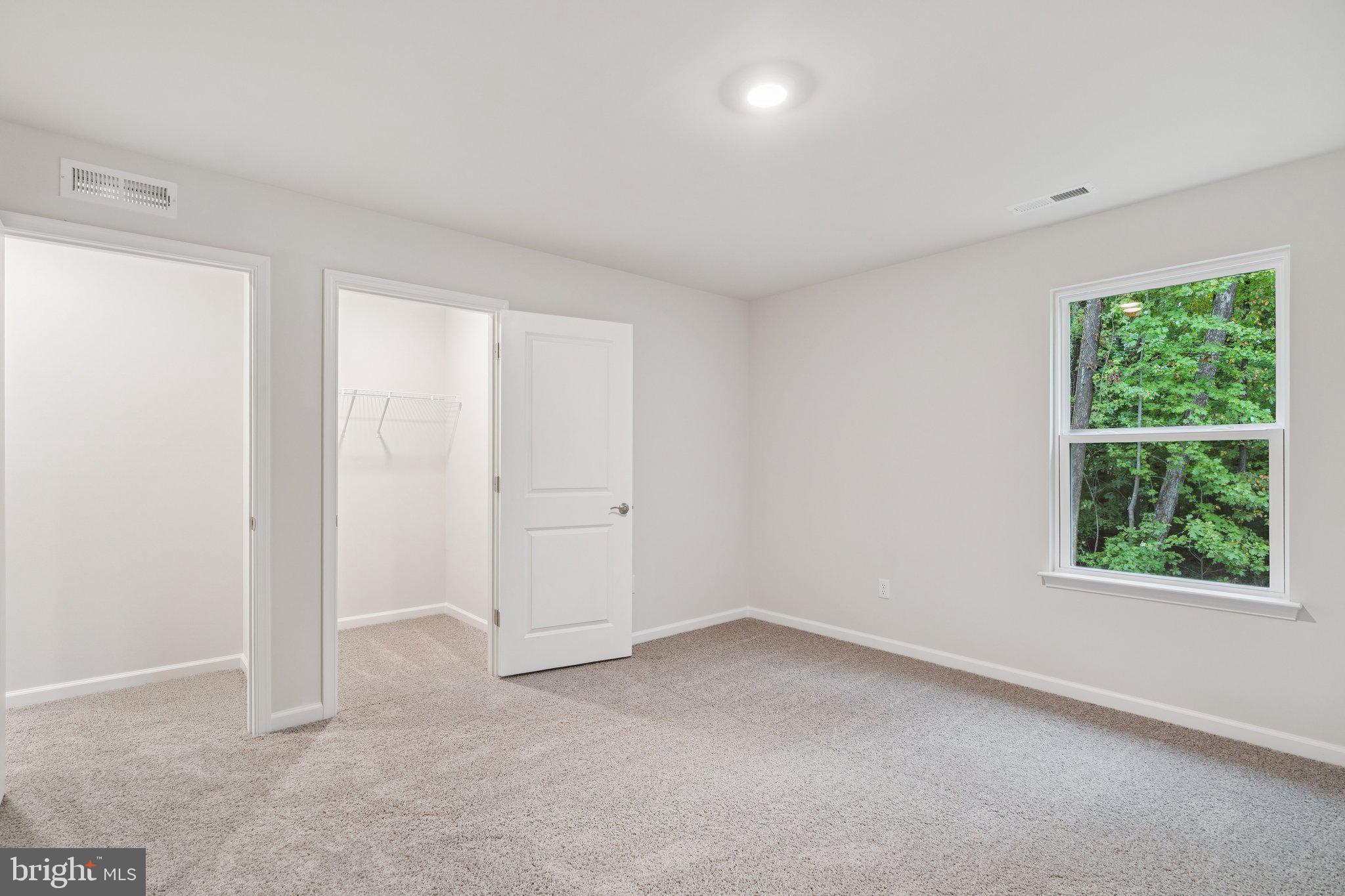 6278 Sterling Way Ruther Glen, VA 22546 - Photo 24 of 32 an empty room with windows
