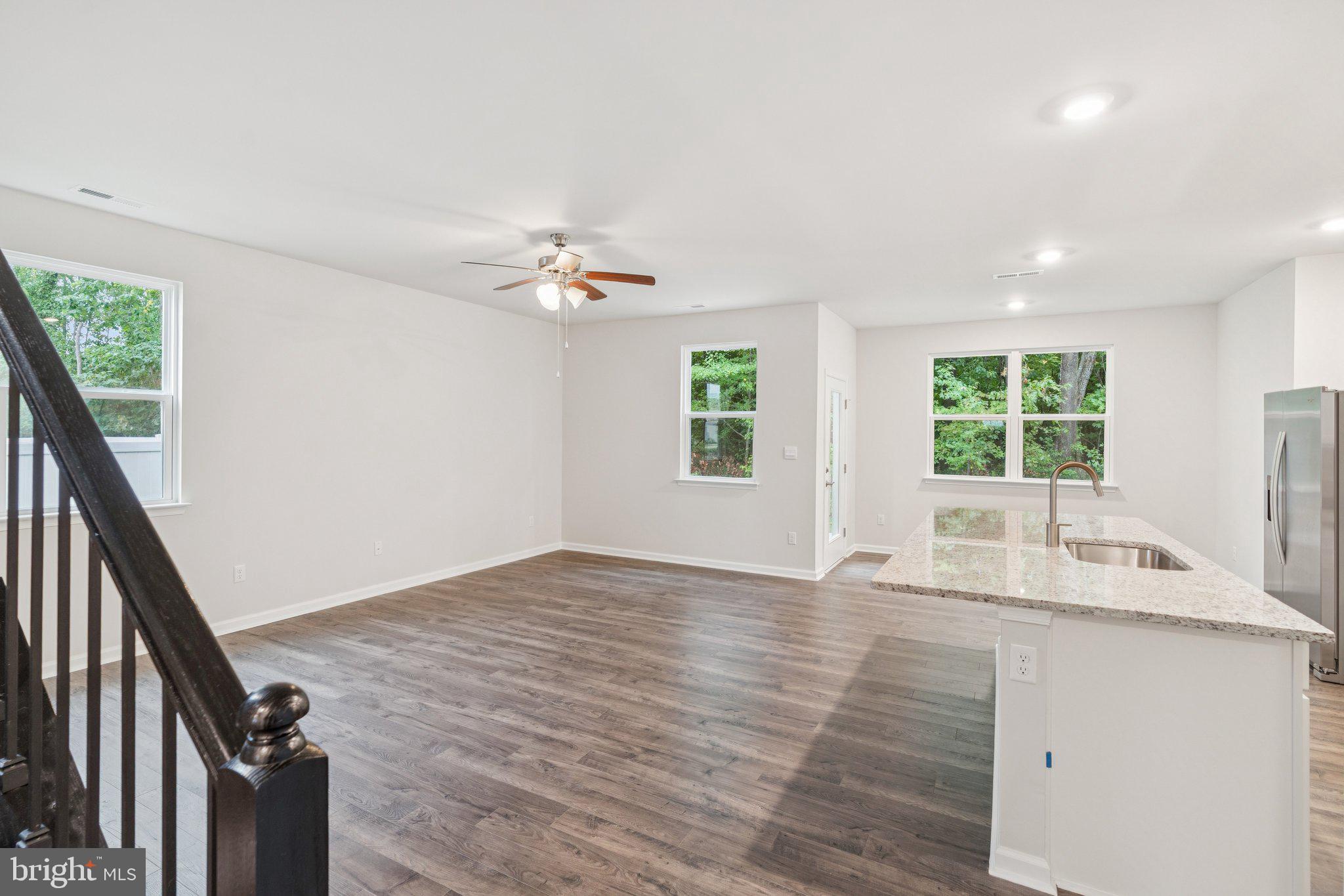 6278 Sterling Way Ruther Glen, VA 22546 - Photo 7 of 32 wooden floor in an empty room with a window