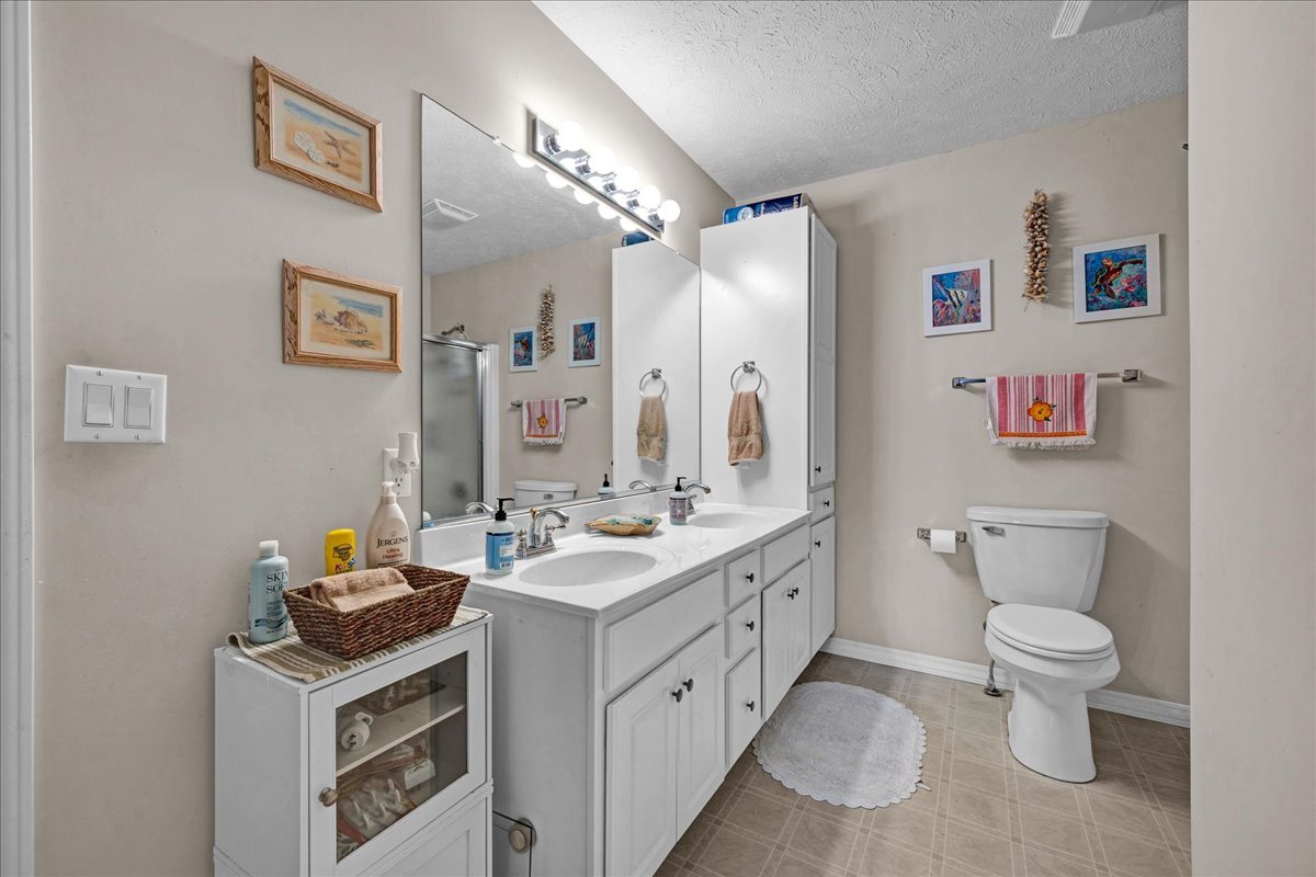 204 Field Drive Normal, IL 61761 - Photo 13 of 34 a bathroom with a double vanity sink mirror and toilet