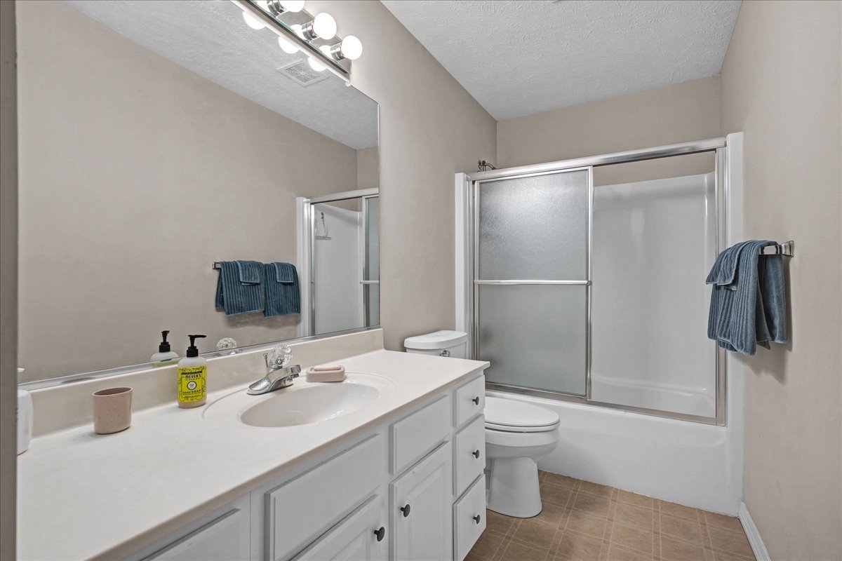 204 Field Drive Normal, IL 61761 - Photo 18 of 34 a bathroom with a sink toilet double vanity and shower