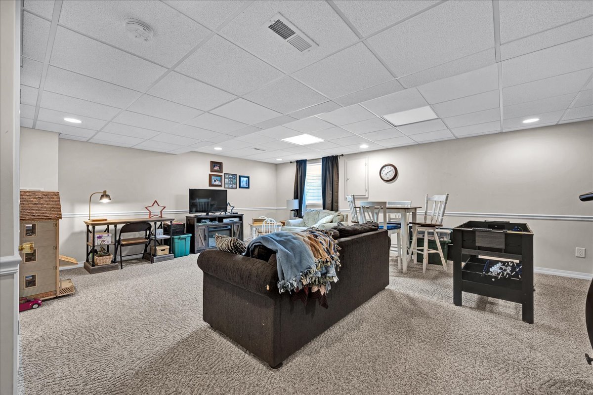 204 Field Drive Normal, IL 61761 - Photo 20 of 34 a living room with furniture and a flat screen tv