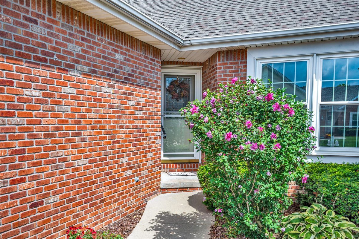 204 Field Drive Normal, IL 61761 - Photo 2 of 34 a flower garden in front of a house