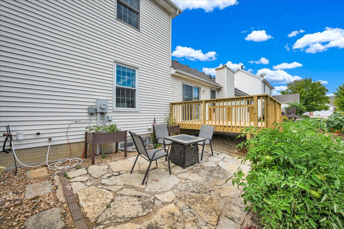 204 Field Drive Normal, IL 61761 - Photo 28 of 34 a view of a house with patio and wooden fence