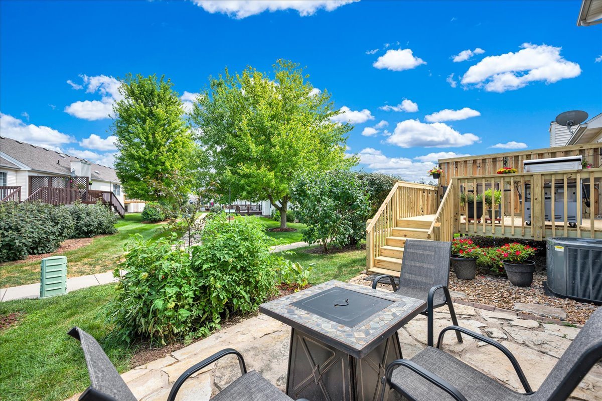 204 Field Drive Normal, IL 61761 - Photo 30 of 34 a view of a chairs and table in patio