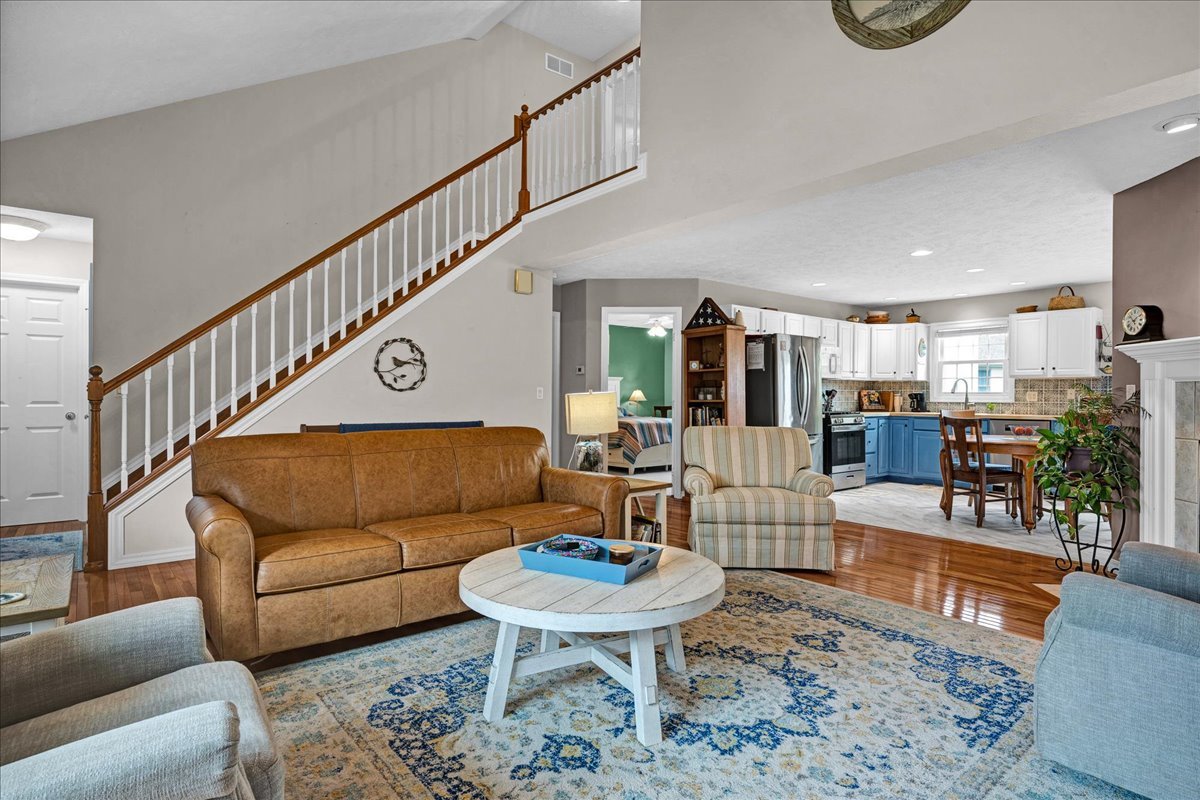 204 Field Drive Normal, IL 61761 - Photo 6 of 34 a living room with furniture and a dining table with wooden floor