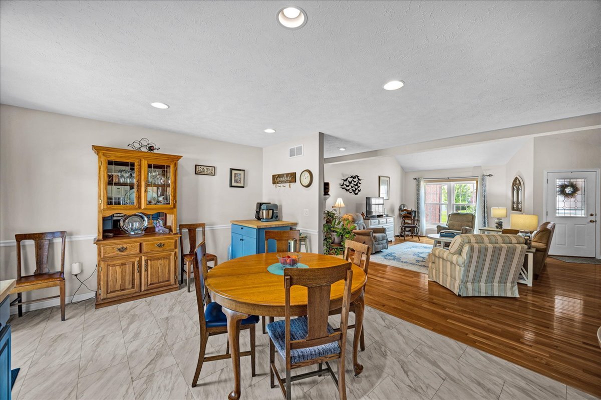 204 Field Drive Normal, IL 61761 - Photo 10 of 34 a view of a dining room with furniture and wooden floor