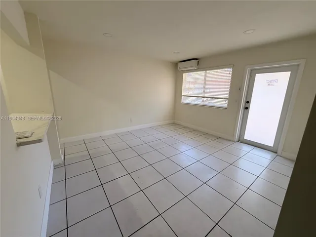 a view of an empty room and window