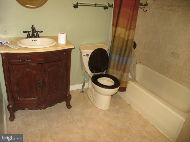 1600 Golf Course Drive Bowie, MD 20721 - Photo 20 of 21 a bathroom with a sink and a mirror