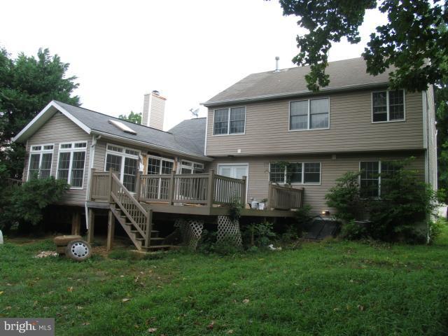 1600 Golf Course Drive Bowie, MD 20721 - Photo 3 of 21 a view of a house with a yard and plants
