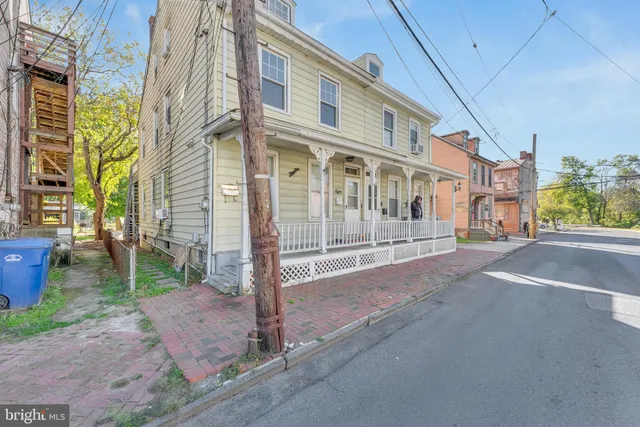 a view of a street with a building in the background