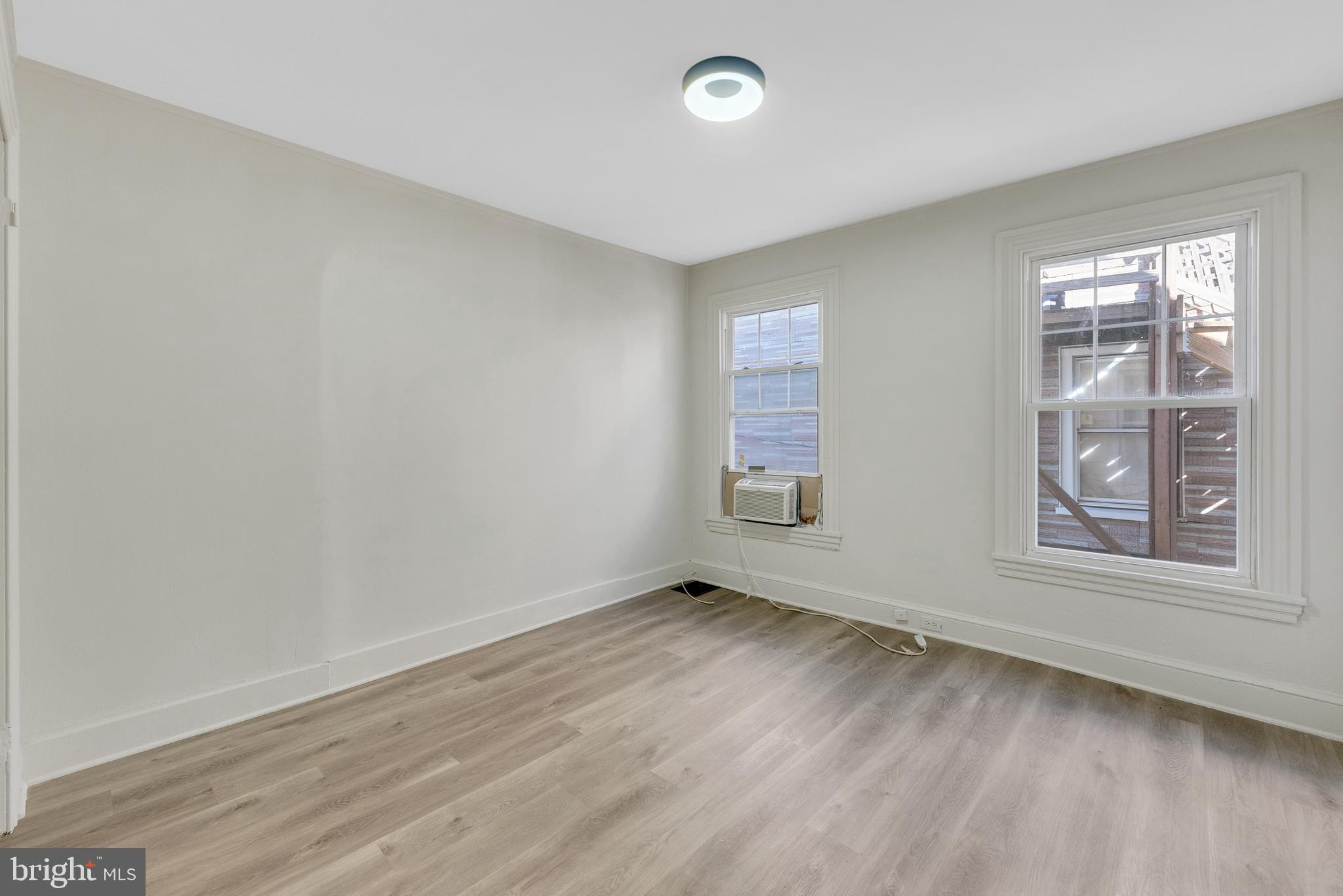8 Church Street, Unit B Mount Holly, NJ 08060 - Photo 8 of 15 an empty room with windows