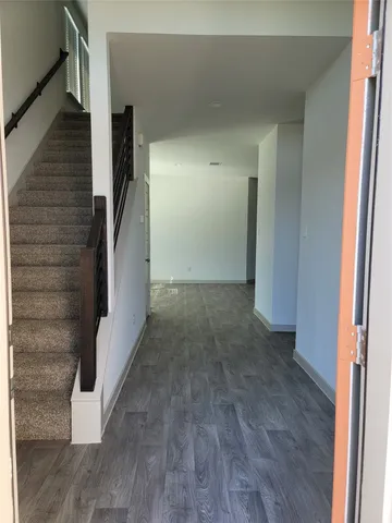 a view of entryway with wooden floor