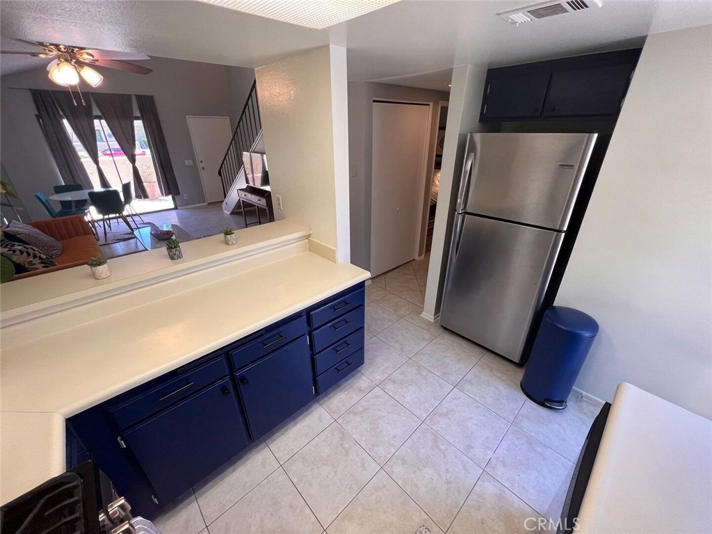 69646 Antonia Way Rancho Mirage, CA 92270 - Photo 15 of 50 a kitchen with stainless steel appliances a refrigerator and a sink