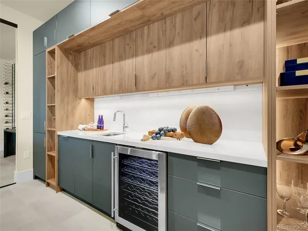 an empty room with windows and cabinet