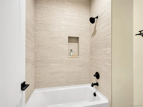 an empty room with a projector and furniture