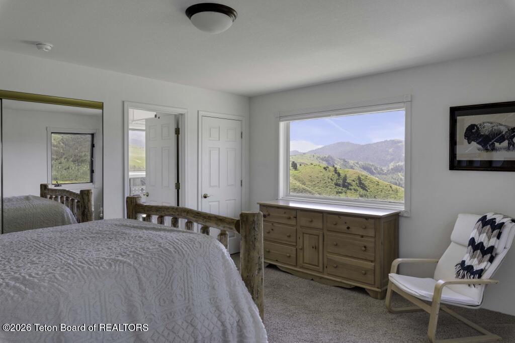 7585 South Squaw Creek Road Jackson, WY 83001 - Photo 20 of 26 Primary Bedroom