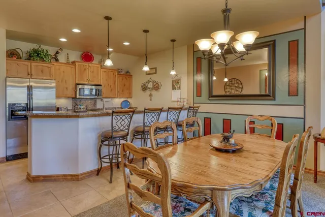 a kitchen with a table and chairs in it