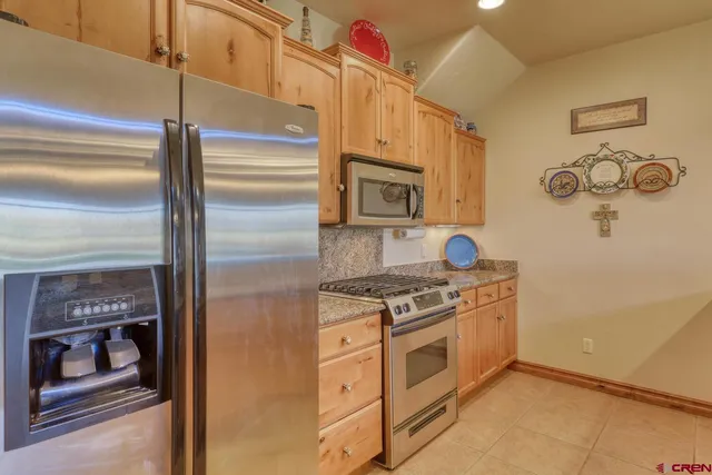 a kitchen with a stove and a microwave