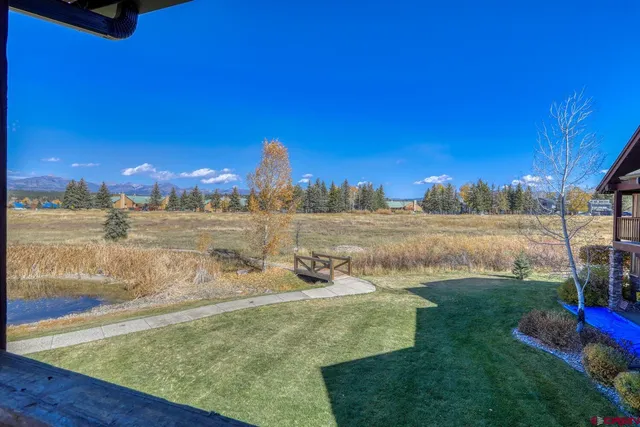 a view of a lake with a big yard