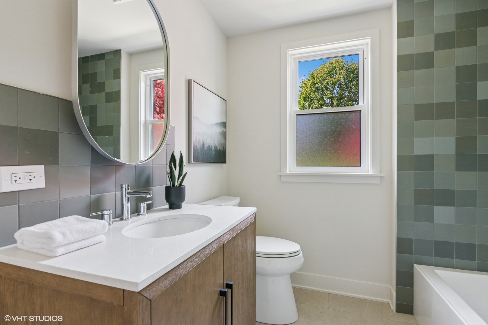 148 Geneva Road Glen Ellyn, IL 60137 - Photo 28 of 45 a bathroom with a sink and a mirror