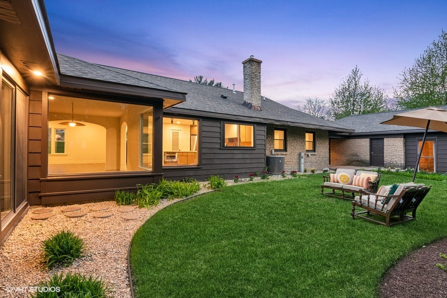 148 Geneva Road Glen Ellyn, IL 60137 - Photo 40 of 45 a front view of a house with garden