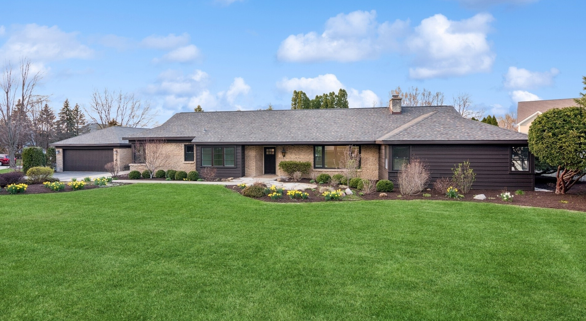 148 Geneva Road Glen Ellyn, IL 60137 - Photo 45 of 45 a front view of a house with a garden