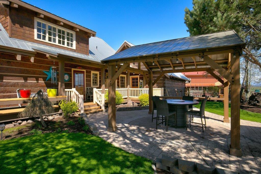 10572 Fleming Road Powell Butte, OR 97753 - Photo 21 of 54 Covered backyard BBQ area